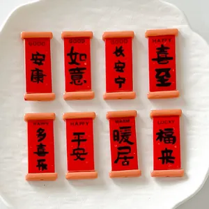 Set of red resin scroll charms with festive Chinese blessings for DIY crafts