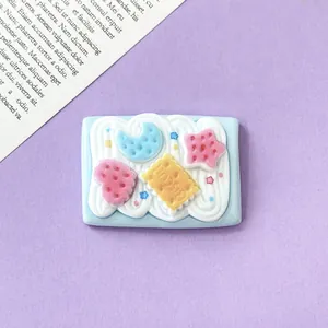 Detailed macro view of a cute DIY resin charm with moon, star, and cream biscuit design