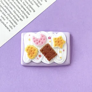 Close-up of a large cute simulation cream biscuit accessory with stars and moon