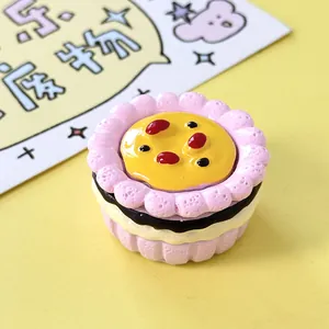 Close-up of a miniature pink flower-shaped cream cake DIY craft accessory