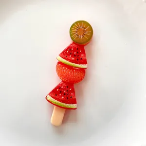 High-resolution detail of a realistic fruit skewer resin charm for DIY phone case decor