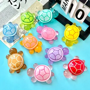 Detailed view of colorful luminous resin turtle ornaments in various bright colors