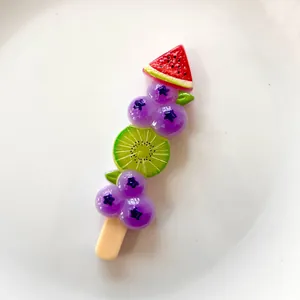 Detailed view of colorful simulated fruit skewer resin accessory for DIY phone case crafts