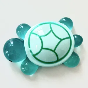 Detailed view of luminous resin turtle figurine with mint green shell and cyan limbs