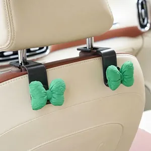 Pair of cute green bow car seat back hooks for interior storage and decoration