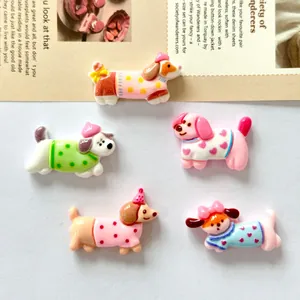 Detailed view of five colorful cute flat-back resin dog charms for DIY craft phone case decoration