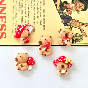 Close-up of five cute capybara resin charms with mushroom hats for DIY crafts