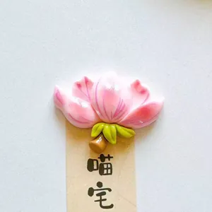 Close-up detail showing a lovely pink peach blossom flower fridge magnet on card