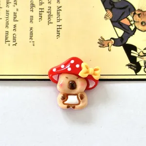 Macro view of a cute resin capybara charm with a red mushroom hat for DIY crafts