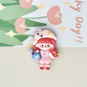 Close-up detail of a cute cartoon girl 3D fridge magnet holding a blue watering can