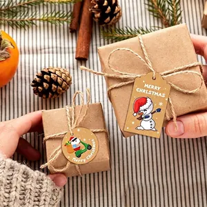 Festive brown kraft paper gift tags with cute snowman and Santa illustrations on boxes