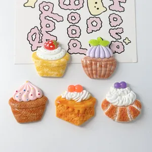 Detail view of five different colorful resin dessert charms for DIY craft projects