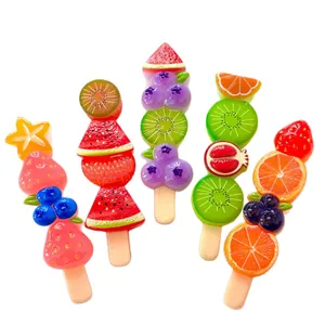 Vibrant resin fruit skewer miniatures for DIY crafts, including strawberry and kiwi designs.
