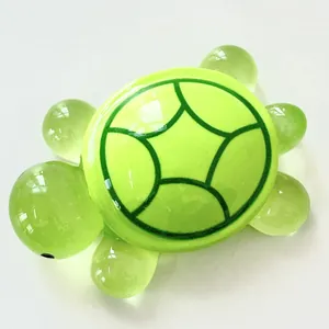 Detailed view of a translucent green resin turtle figurine with a bright lime green shell