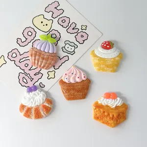 Detailed close-up of assorted resin dessert charms for DIY crafts and jewelry making projects