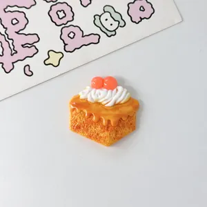 Detailed macro shot of a resin cream cake DIY craft accessory with orange glaze finish