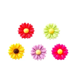 Five colorful resin daisy flower charms for DIY crafts, hair clips, and phone cases.