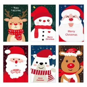 Vista detallada de seis cajas de regalo de dulces de Navidad con Papá Noel y renos