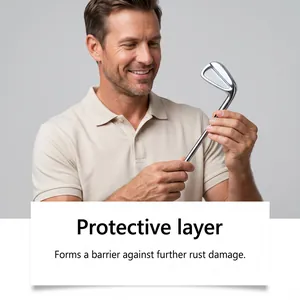 Man inspecting a shiny, polished golf club head with a rust-resistant protective coating