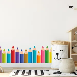 Close-up view of colorful pencil wall stickers applied to nursery skirting boards.