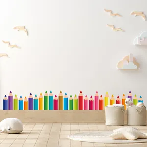 Detailed view of colorful pencil wall stickers used as a nursery baseboard border.