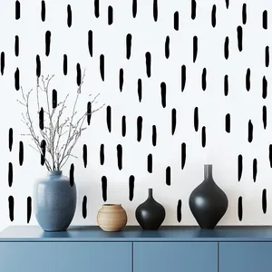 Vue détaillée de stickers muraux à rayures noires irrégulières dans un salon moderne