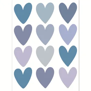 Close-up detail of self-adhesive heart stickers in various soft blue and purple shades