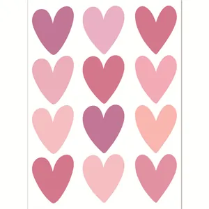 Detail of colorful pink and rose heart-shaped wall stickers on white adhesive sheet