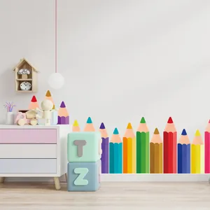 Creative colorful pencil wall stickers applied as baseboard decor in a nursery room