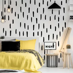 Vue détaillée des stickers muraux à rayures noires irrégulières dans une chambre moderne