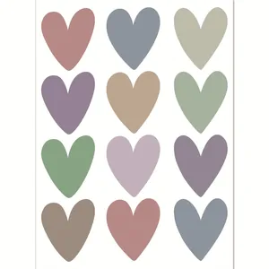 Set of 12 colorful heart wall stickers in muted pastel tones for nursery room decor
