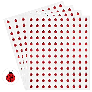 Close-up view of 1.3cm red cartoon ladybug stickers for children's DIY crafts and toys
