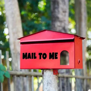 Detail of 2-inch black bold letter stickers spelling 'MAIL TO ME' on a red mailbox