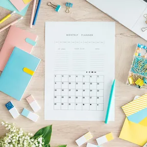 Detailed monthly planner page layout with goal setting and notes for creative journaling.