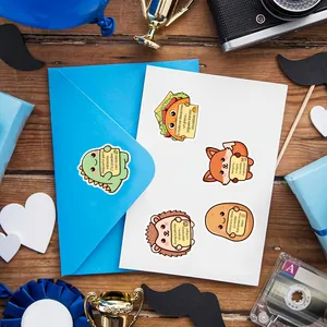 Spanish motivational stickers with cute animal illustrations on a blue envelope background