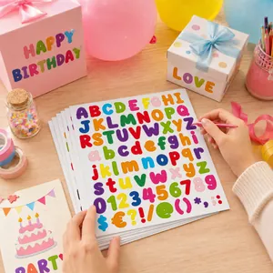 Detailed view of colorful 1-inch bubble letter and number stickers for DIY scrapbooking.