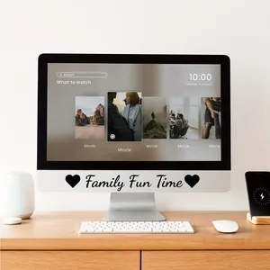 Black cursive Family Fun Time vinyl letter stickers applied to a white computer monitor base