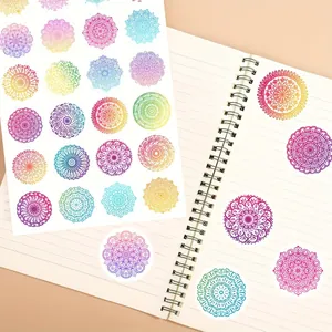 Detail view of colorful mandala round stickers used for decorating a journal notebook.