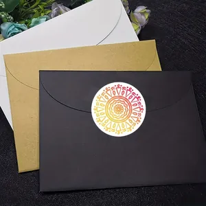 Close-up view of a vibrant colorful mandala round sticker sealing a premium black envelope