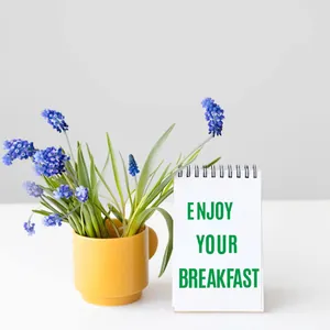 Waterproof 2-inch green alphabet stickers applied to a notepad for creative home decoration