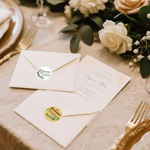 Romantic floral 'Gracias' seal stickers applied to white envelopes for wedding decor