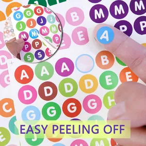 Detailed view of 0.5 inch waterproof alphabet stickers being peeled easily for DIY.