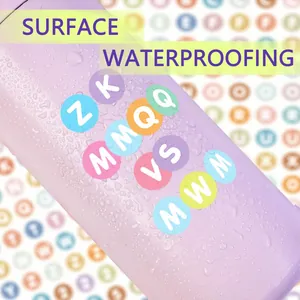 Close-up of waterproof colorful 0.5 inch round letter stickers on a smooth surface