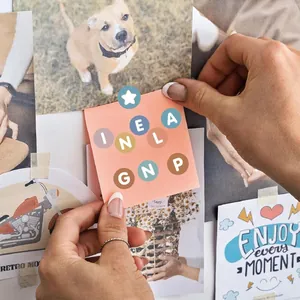 Close-up lifestyle detail of 0.5 inch colorful alphabet dot stickers for DIY scrapbooking