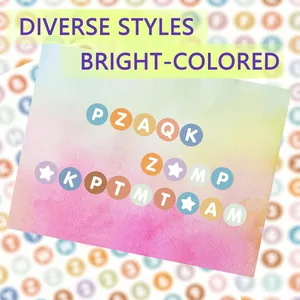 Close-up of 0.5 inch colorful alphabet circle stickers on watercolor background