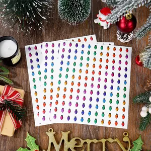 Detailed view of mini colorful Christmas bulb stickers for DIY gift decoration.