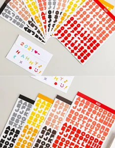 Macro view of colorful alphabet and number sticker sheets for creative scrapbooking DIY