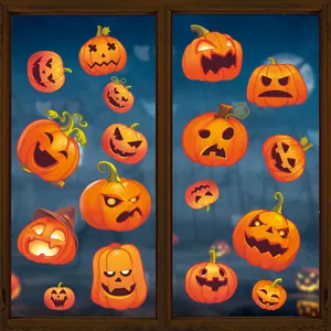 Macro view of various orange Jack-o-lantern stickers applied to a glass window.