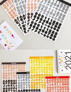 Detail view of colorful alphabet and number stickers for DIY journal and phone case decoration