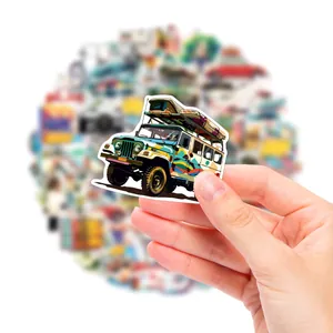 Detailed view of colorful off-road vehicle sticker held by hand for scale